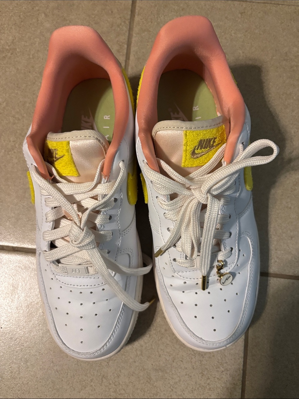 Nike White Leather Sneakers with Yellow Tongue Patch & Coral Lining